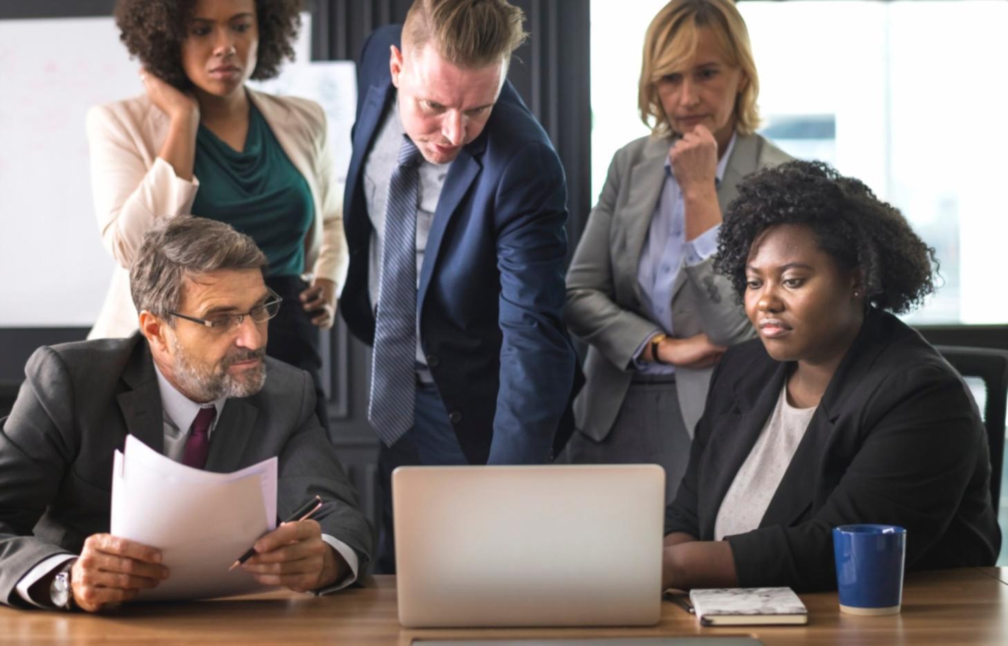 Collaborative team meeting discussing workflow improvements